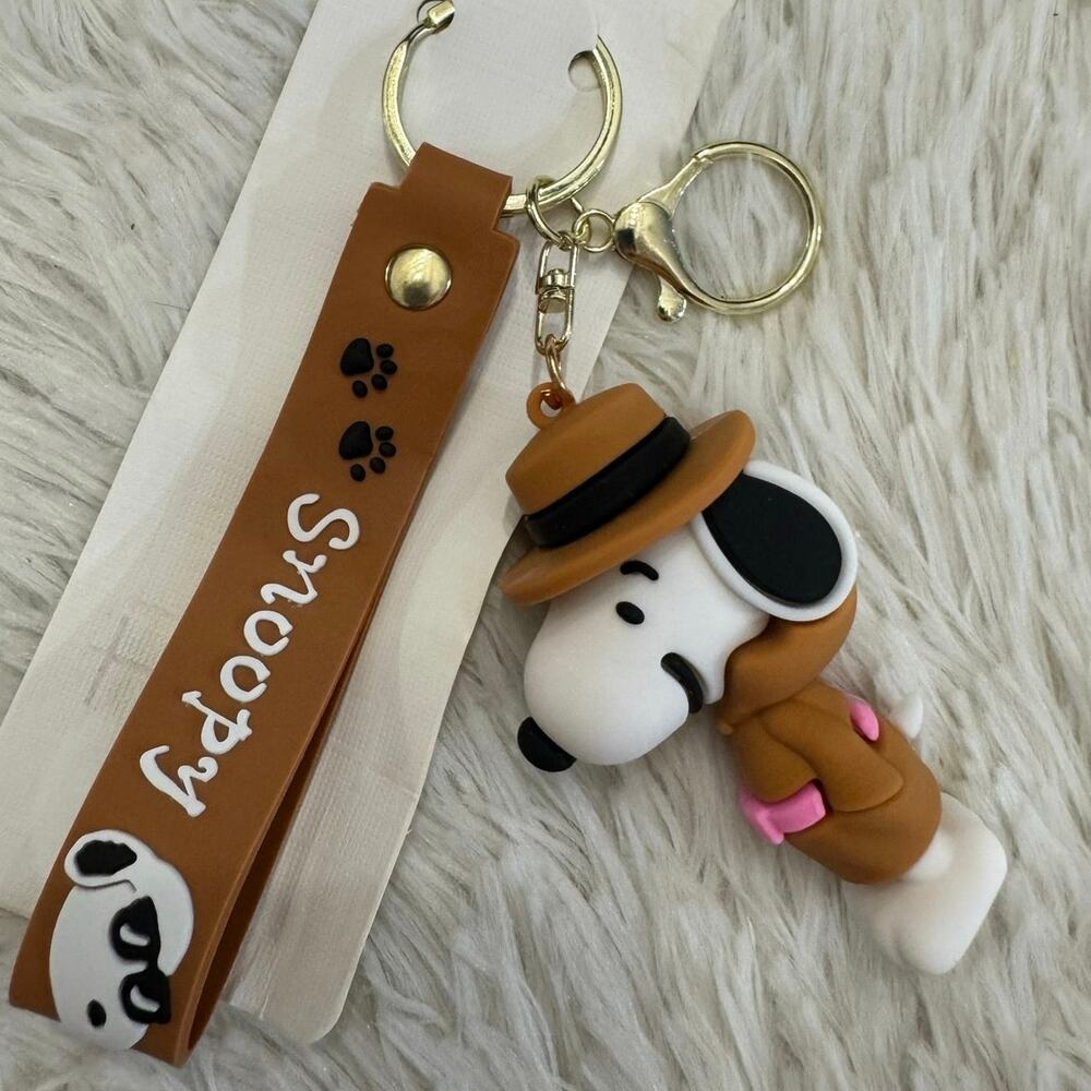 Snoopy keychain with brown strap inspector clothes and hat